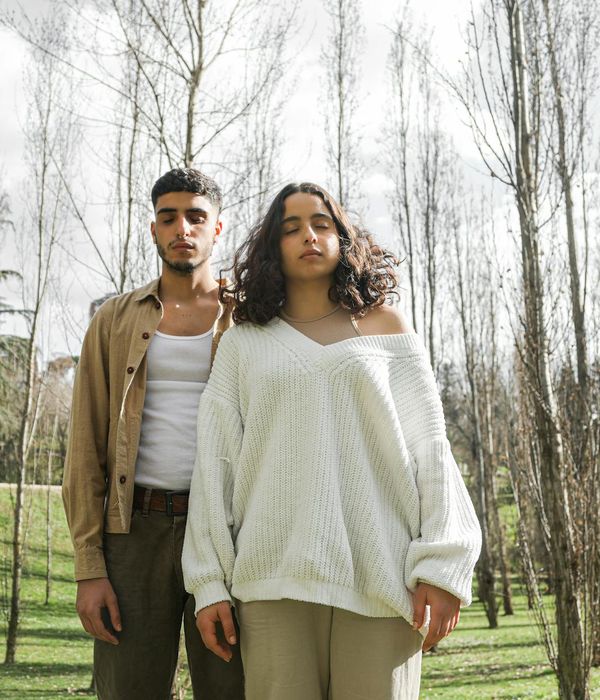 Man meditating peacefully in a minimalist environment.